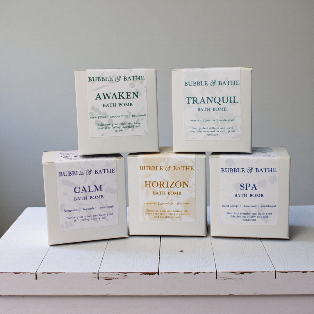 Full collection of Bubble & Bathe luxury aromatherapy bath bombs featuring all five ritual scents: Awaken, Calm, Horizon, Spa, and Tranquil lined up together.