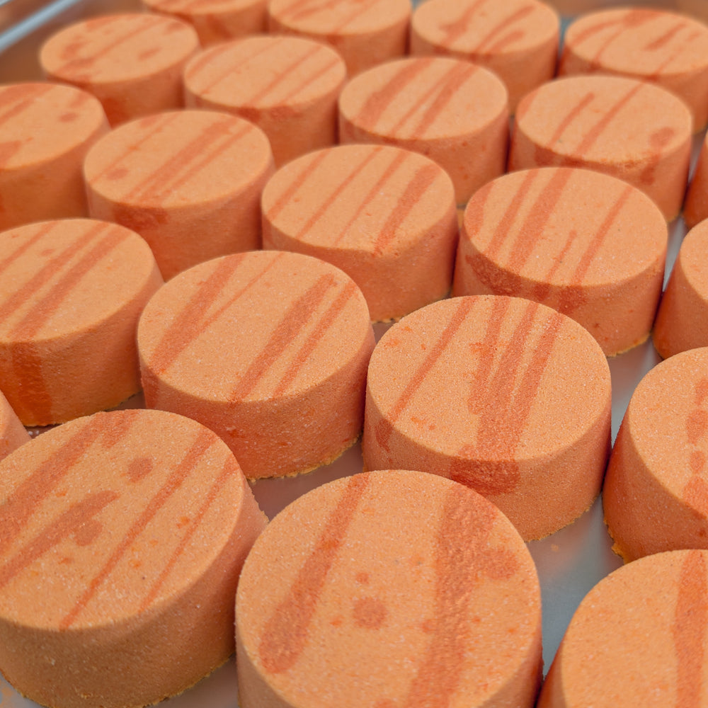 Amalfi - This is a close-up image of a colourful, handmade moisturising bath bomb, designed for a relaxing spa bath experience, highlighting its natural ingredients and textured surface, perfect for aromatherapy and soothing skin.