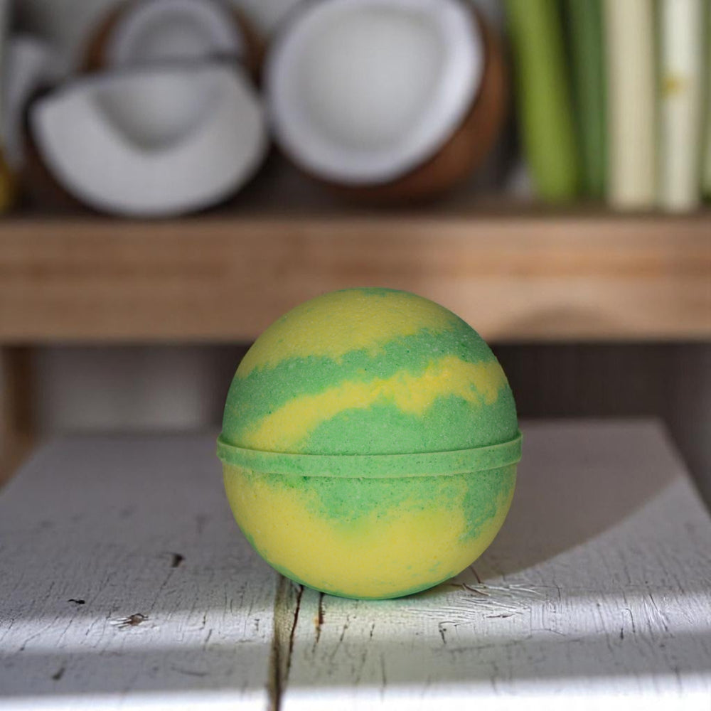 Coconut & Lemongrass jumbo bath bomb by Bubble & Bathe, handmade in North Devon, yellow bath bomb with tropical coconut, lime, and ginger scent, vegan and plastic-free

