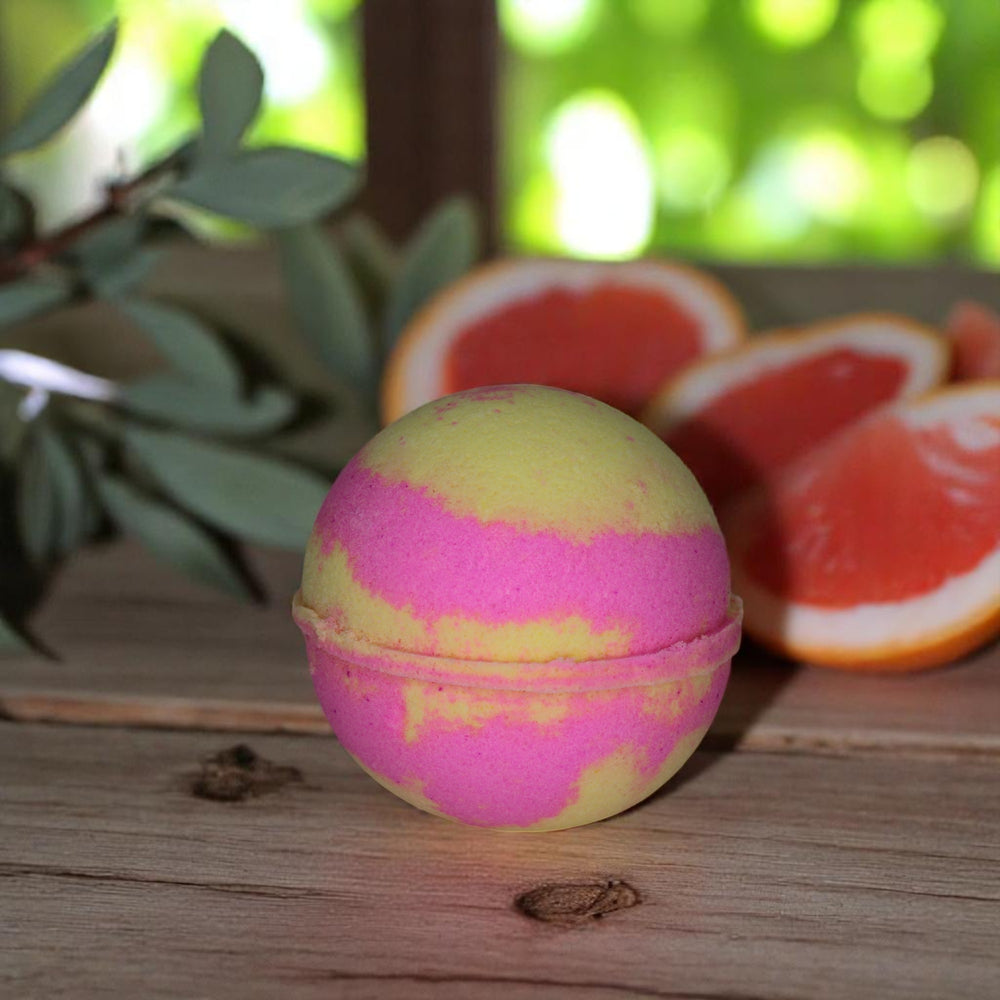 Grapefruit & Ginger jumbo bath bomb by Bubble & Bathe, handmade in North Devon, pink and yellow bath bomb with citrus and ginger scent, vegan and plastic-free