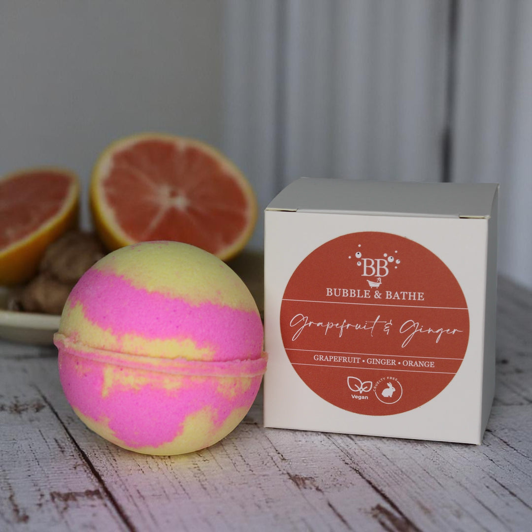 Grapefruit & Ginger jumbo bath bomb by Bubble & Bathe, handmade in North Devon, pink and yellow bath bomb with citrus and ginger scent, vegan and plastic-free