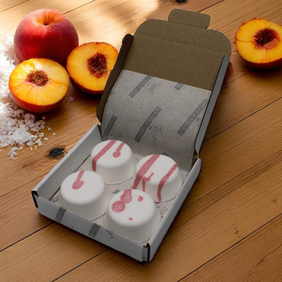 Peach & Coconut vegan shower steamers by Bubble & Bathe, handmade in North Devon, peach, coconut milk, and frangipani scent, box of 4, plastic-free packaging