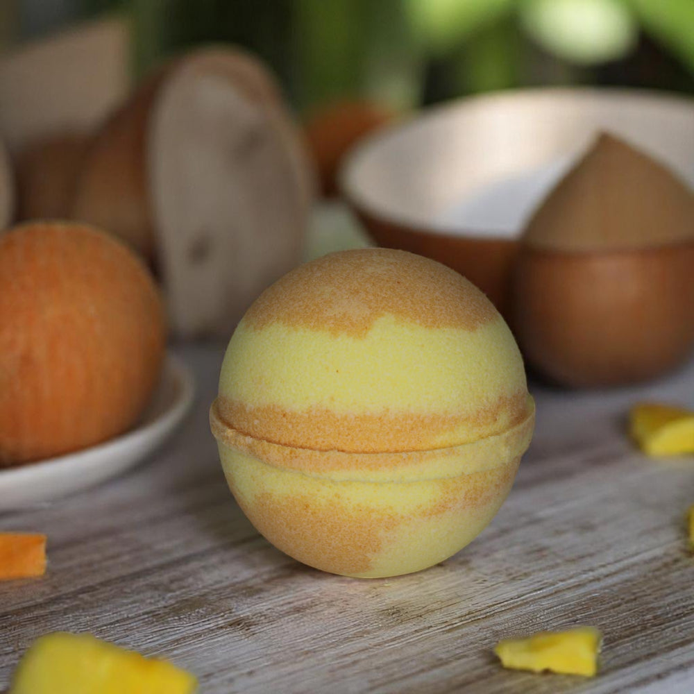 Mango & Papaya jumbo bath bomb by Bubble & Bathe, handmade in North Devon, yellow and orange bath bomb with sweet mango and papaya scent, vegan and plastic-free