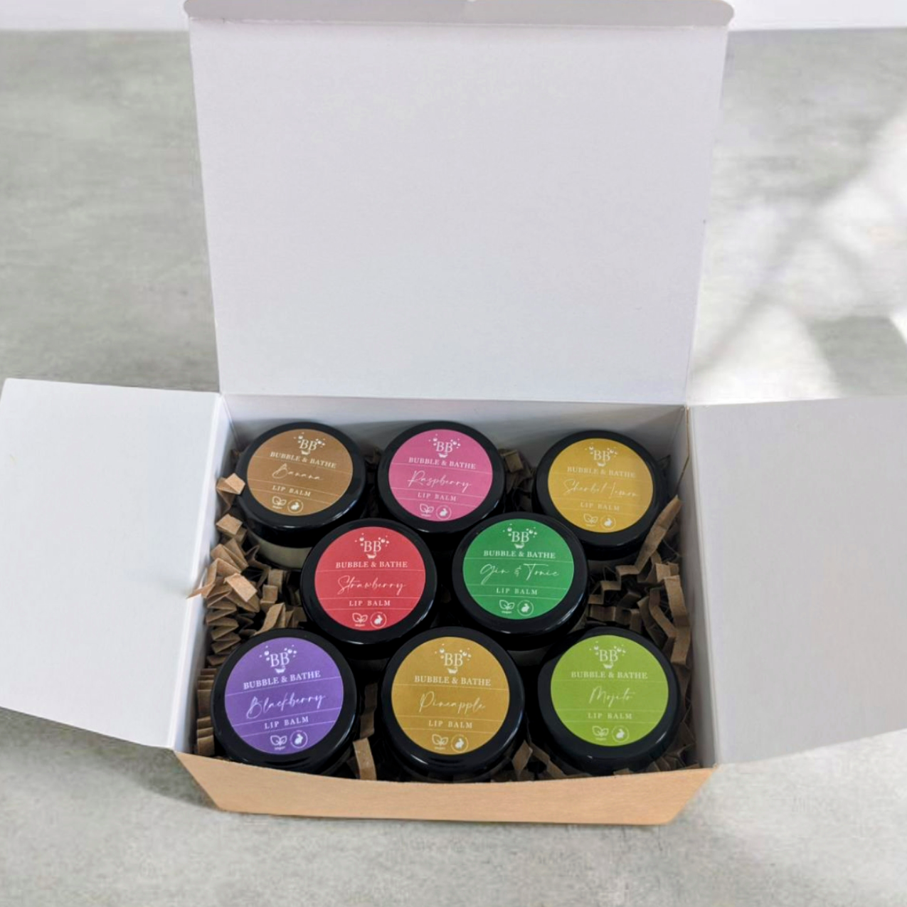 Bubble & Bathe Lip Balm Gift Set with 8 flavours, displayed in eco-friendly packaging.