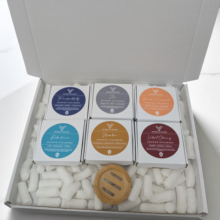 Shower Steamers Mystery Box by Bubble & Bathe, includes six boxes of vegan shower steamers and a bamboo tray, handmade in North Devon, assorted scents, plastic-free packaging